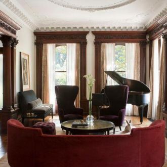 curved-red-deep-sofa-piano-room