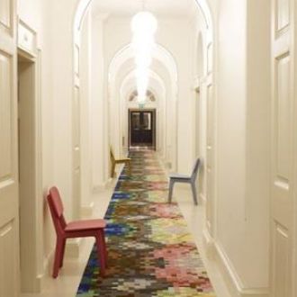 narrow-hallway-colorful-rug